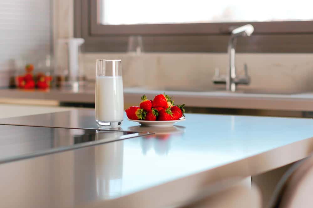 Latest and modern glass countertop for kitchen by Granite Fabrication Center in Carrollton TX